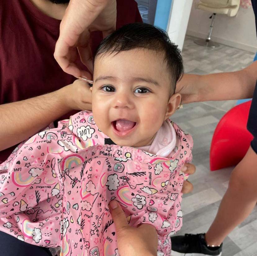 picture of child having hair cut