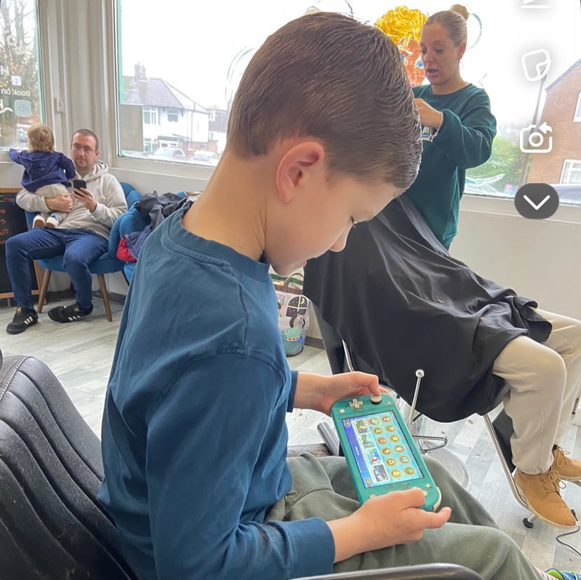 picture of child having hair cut