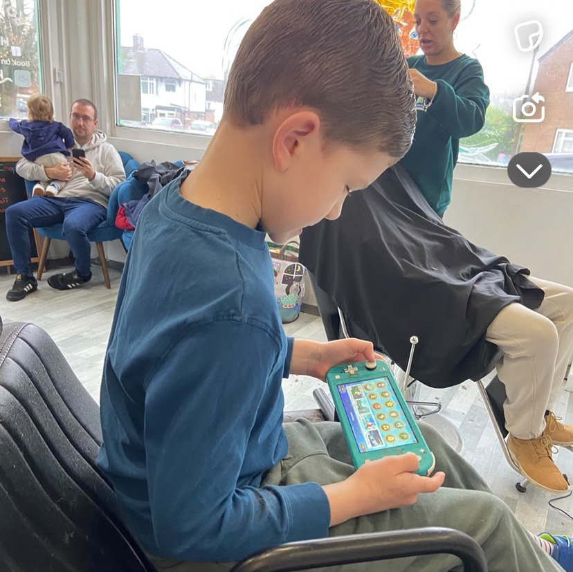picture of child having hair cut