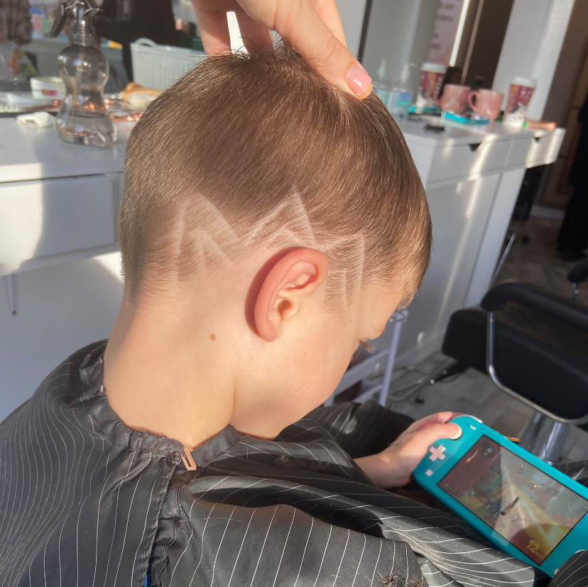 picture of child having hair cut
