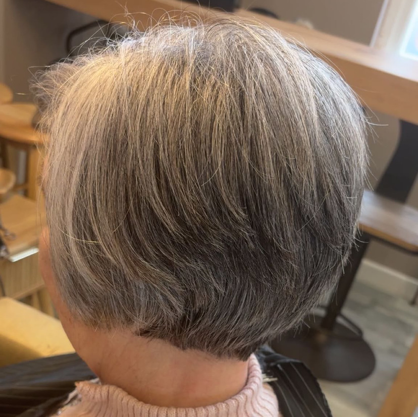 picture of lady having hair cut