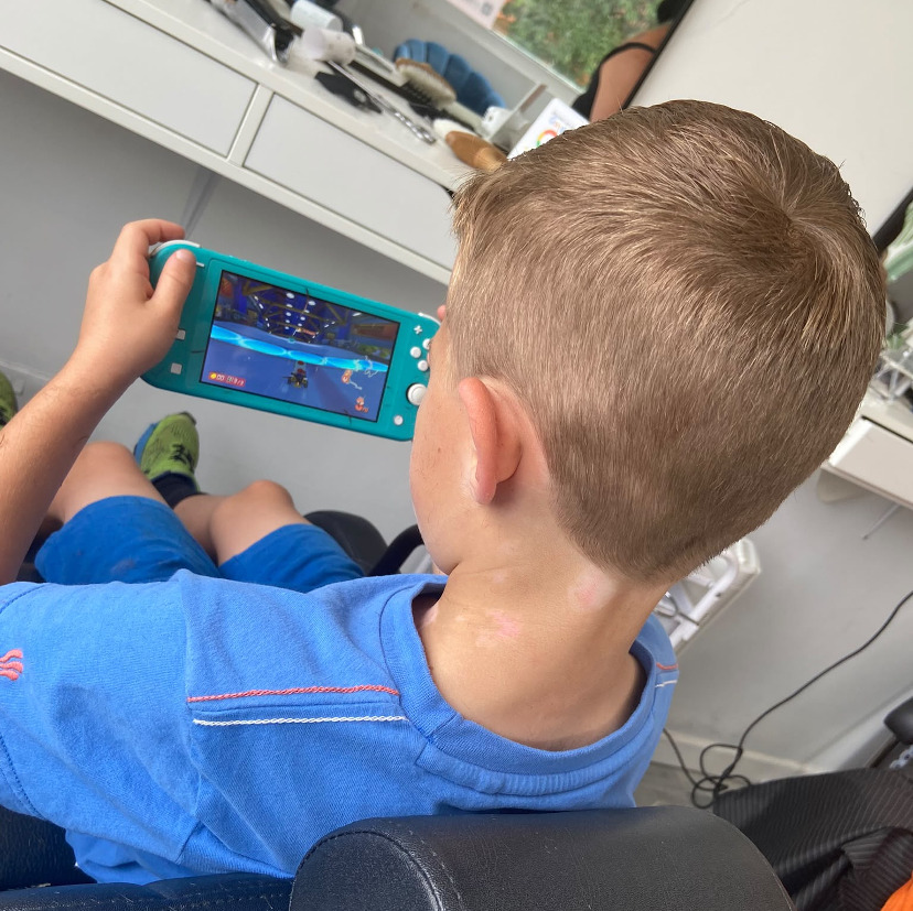 picture of child having hair cut
